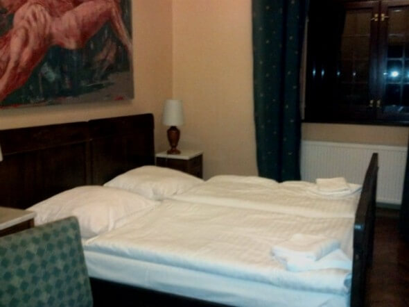 The simple but comfortable bed in my room at the Hotel Zamek Joannitow