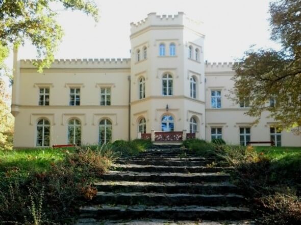 The front of the palace overlooks a sprawling garden 