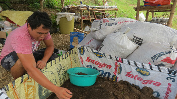 Wilson showing earthworms helping create excellent dirt