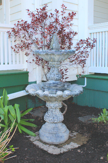 A fountain and flowerbed detail.