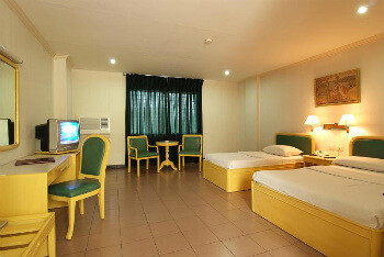 The Diplomat--Deluxe room with one double bed and single bed.