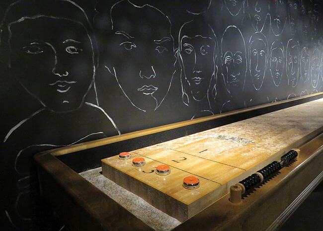 Table shuffleboard in Hotel Zetta Playroom