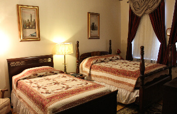 Room with a double and single bed