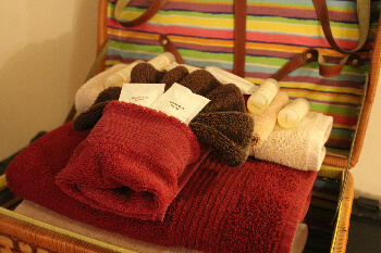 A basket of towels and toilettries 