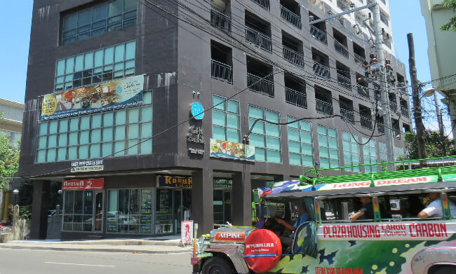 Flag down a jeepney outside City Suites to travel like the locals.