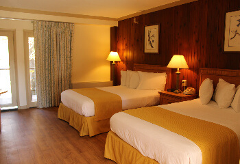 A double guest room with a balcony overlooking Dewey Lake