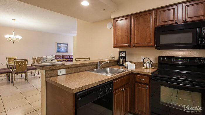 Our 2-bedroom villa includes a full kitchen with dining room at Mystic Dunes Resort.