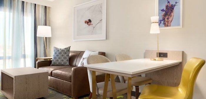 Living room area of the all-suites Embassy Suites by Hilton King size room.