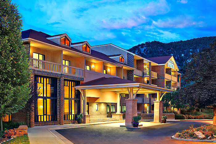 Located behind the hot springs pool, check into the Glenwood Hot Springs Resort in Glenwood Springs, Colorado