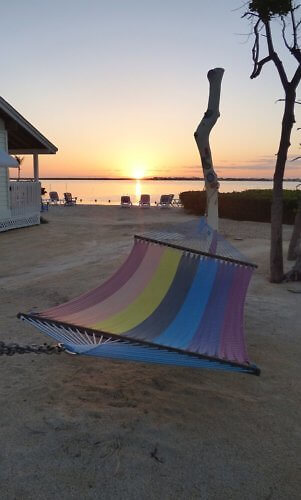 Hammock by the sea at sunset at Parmer's Resort in the Florida Keys, on Little Torch Key