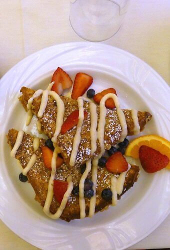 Oatmeal encrusted French Toast with brown sugar cream and berries at the Bistro at La Tourelle Hotel near Ithaca