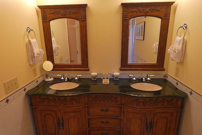 Fireplace king suite bathroom at La Tourelle Hotel Ithaca