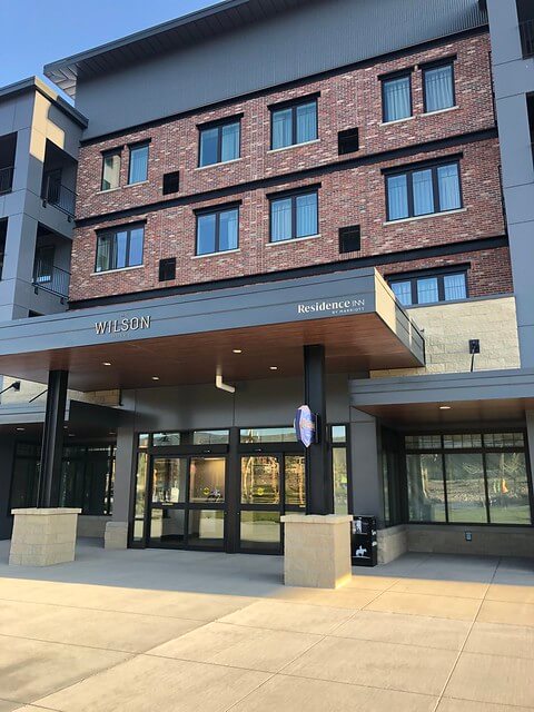 Brick exterior creates the sleek look at The Wilson Hotel with Residence Inn Marriott logo.