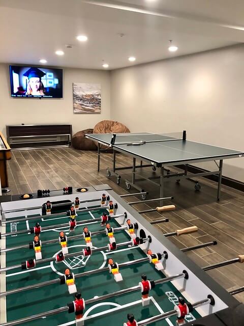 Hotel game room includes ping pong table, shuttleboard and foosball.