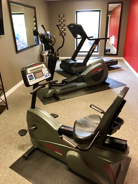 Three Life Fitness machines fill the hotel gym, including a treadmill.