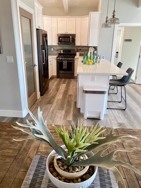 Bird's eye view into the Salty Sister Flagship kitchen with stainless steel appliances and white counter top. 