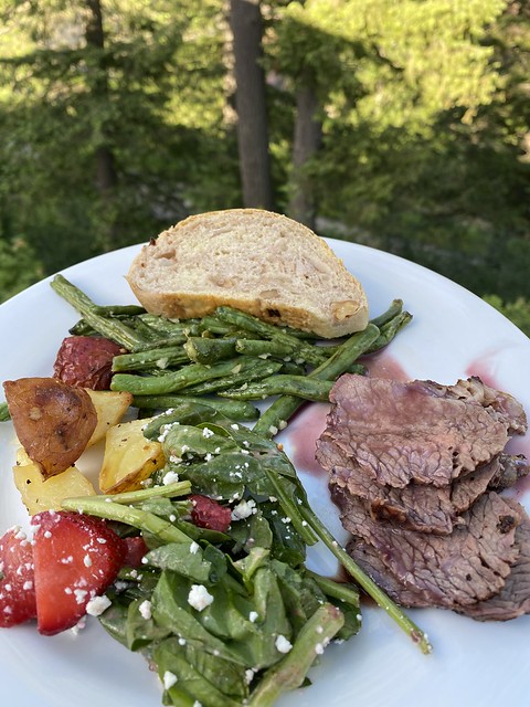 Dinner plate includes beef trii-tip, green beans, roasted potatoes, greek salad, homemade bread. 