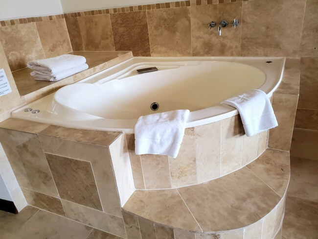 A Jacuzzi spa with towels awaits guests in room at Costa del Sol