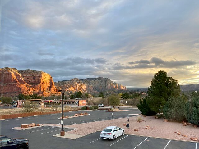 Holiday Inn Express Sedona Oak Creek parking lot with Red Rocks of Arizona.