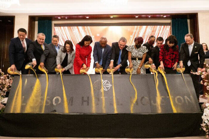 Sand pouring at opening ceremonies of Blossom Hotel Houston Medical Center