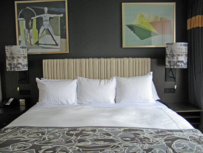 Guest room bed at Saint Kate Hotel (Photo by Susan McKee)