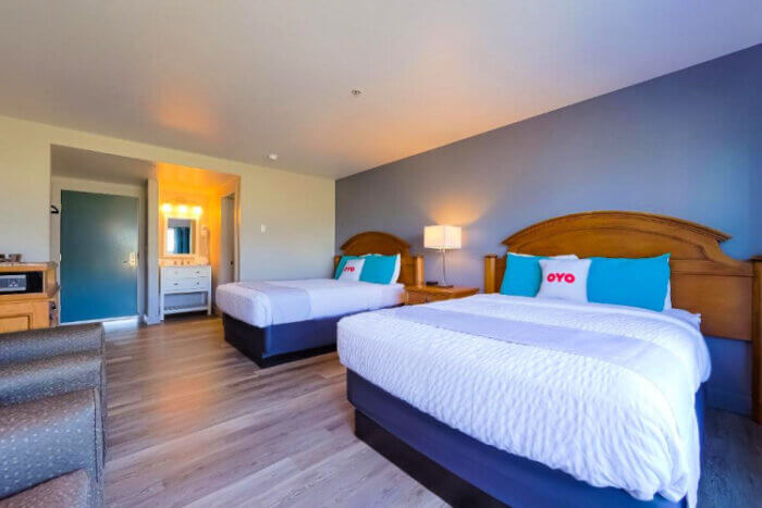 Double queen beds with separate wash room and shower at the Waves Hotel, Newport, Oregon