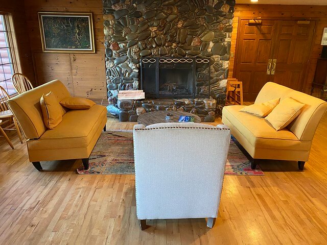 Relax by the river rock stone fireplace in the lodge at Big K Ranch. River stones from the Umpqua River in Elkton, Oregon