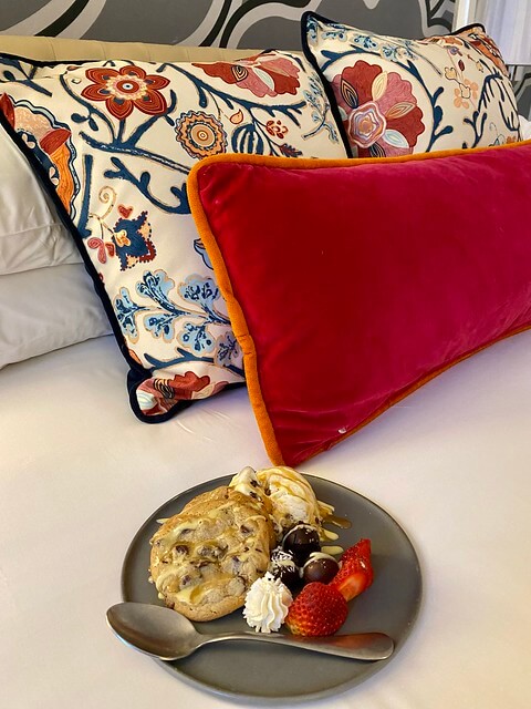 Housemade chocolate chip cookies on the hotel bed