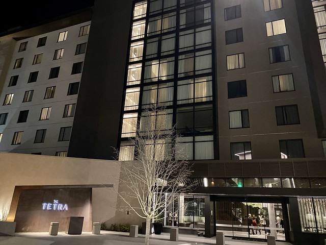 Tetra hotel exterior at night.