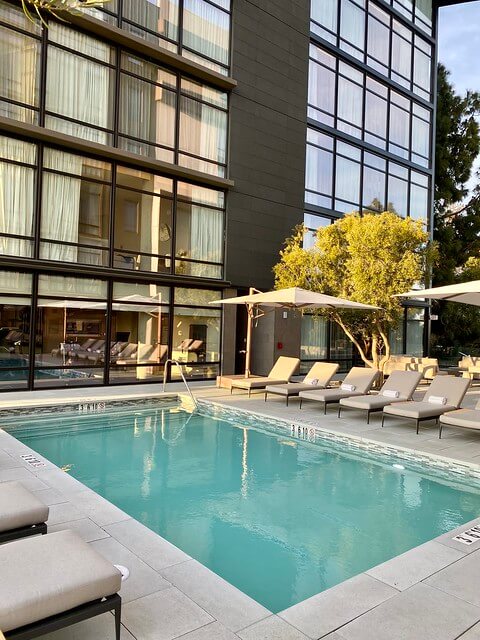 Swimming pool with chaise lounges