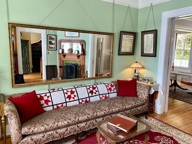 Heceta Lighthouse Bed and Breakfast east parlor with antique mirror over sofa