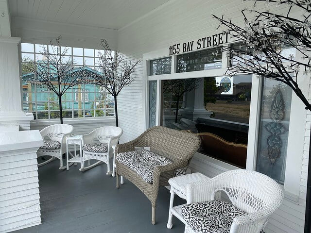 Relax on the wicker furniture on the front porch of Edwin K Bed & Breakfast. There's enough room for several couples on the wicker rocking chairs or wicker love seat at the Edwin K. 