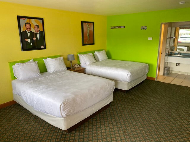 Cortez motel features themed-rooms. My room included 2 double beds with white bedding to compliment the bright yellow and lime green painted walls.