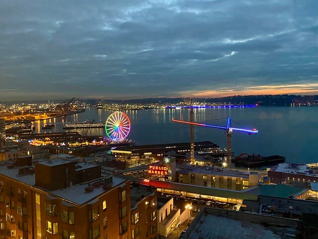 Thompson Seattle hotel has views of Seattle Ferris Wheel & Pike Place Public Market at night. 