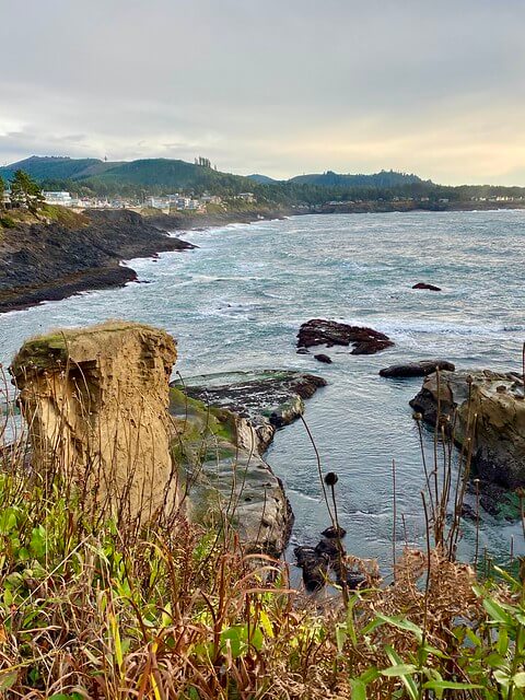 What's left of the collapsed Arch Rock in Depoe Bay on the Oregon coast as seen from Inn at Arch Rock. 