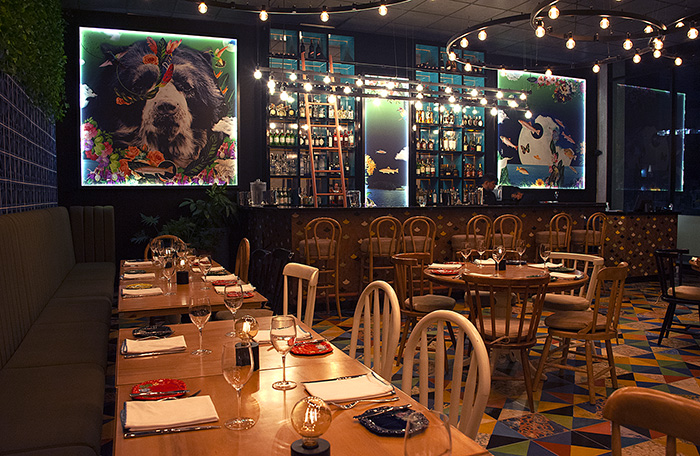 La Floresta bar with paintings of Colombian flora and fauna