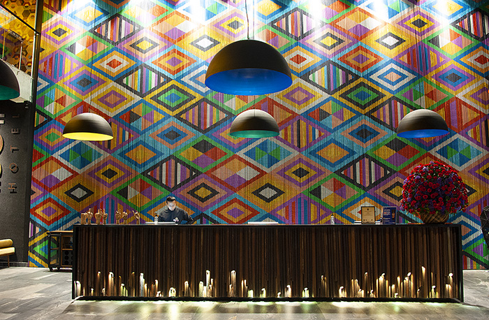 Hotel cafeteria counter with neon fish on ceiling