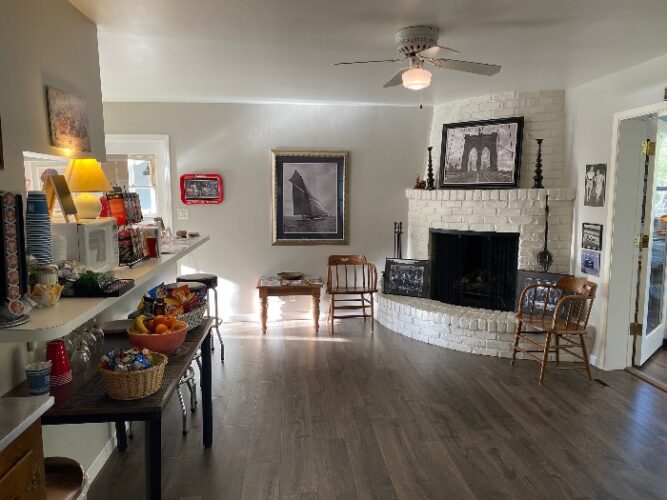 interior of the Stahlecker House with a fireplace and small buffet of snacks