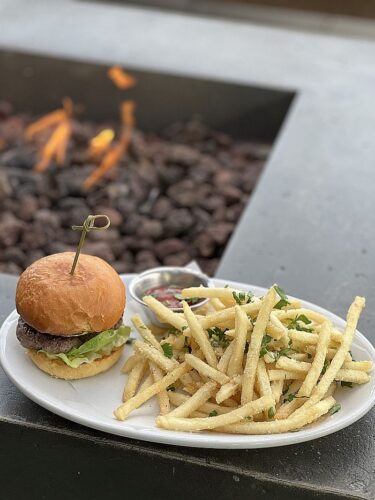 Slider by fire pit at The Rooftop at Harmon Guest House