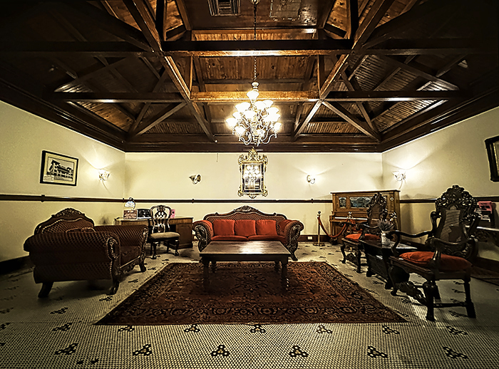 Red velvet Victorian-style furnishings decorate the lobby of the Copper Queen Hotel