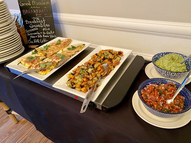 Breakfast quesadilla with black bean hash, guacamole and pico de gallo sauce on the side board at Saratoga Inn