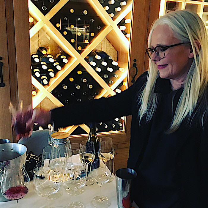 Astrid Young doing pouring wine for tasting.