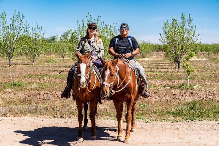 Author and her husband horseback ride near El Paso on a Weekend Getaway