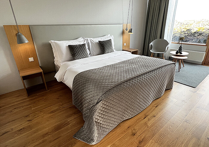 Modern room with white and taupe decor and light-wood accents.