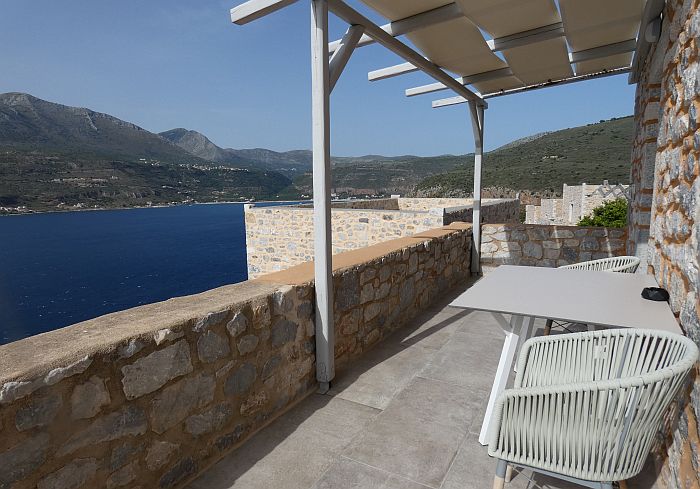 suite balcony with a view of Limeni Bay