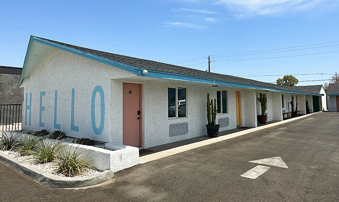 Exterior view of single-story midcentury roadside motel The Aloha