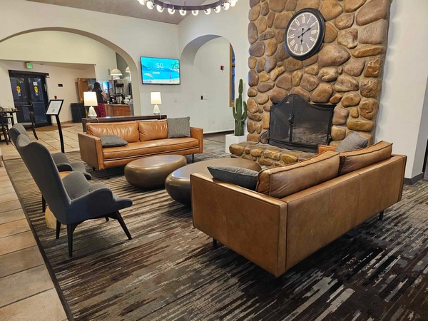 Reception area with sofas and fireplace