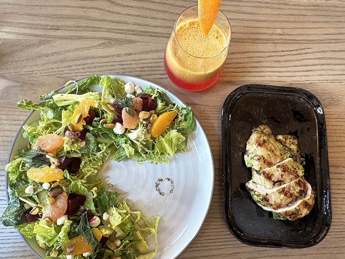 A salad, chicken and fruit juice at Hummingbird restaurant