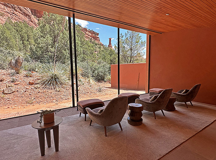 A comfy sitting area looks out to Kachina Woman rock