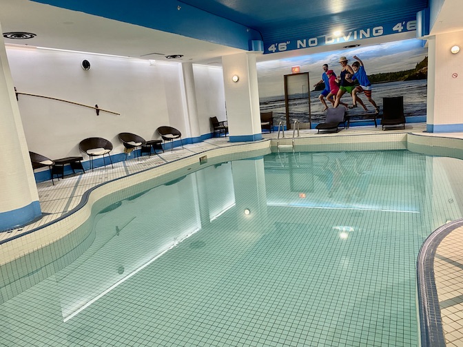 Indoor pool is adjacent to the fitness area.